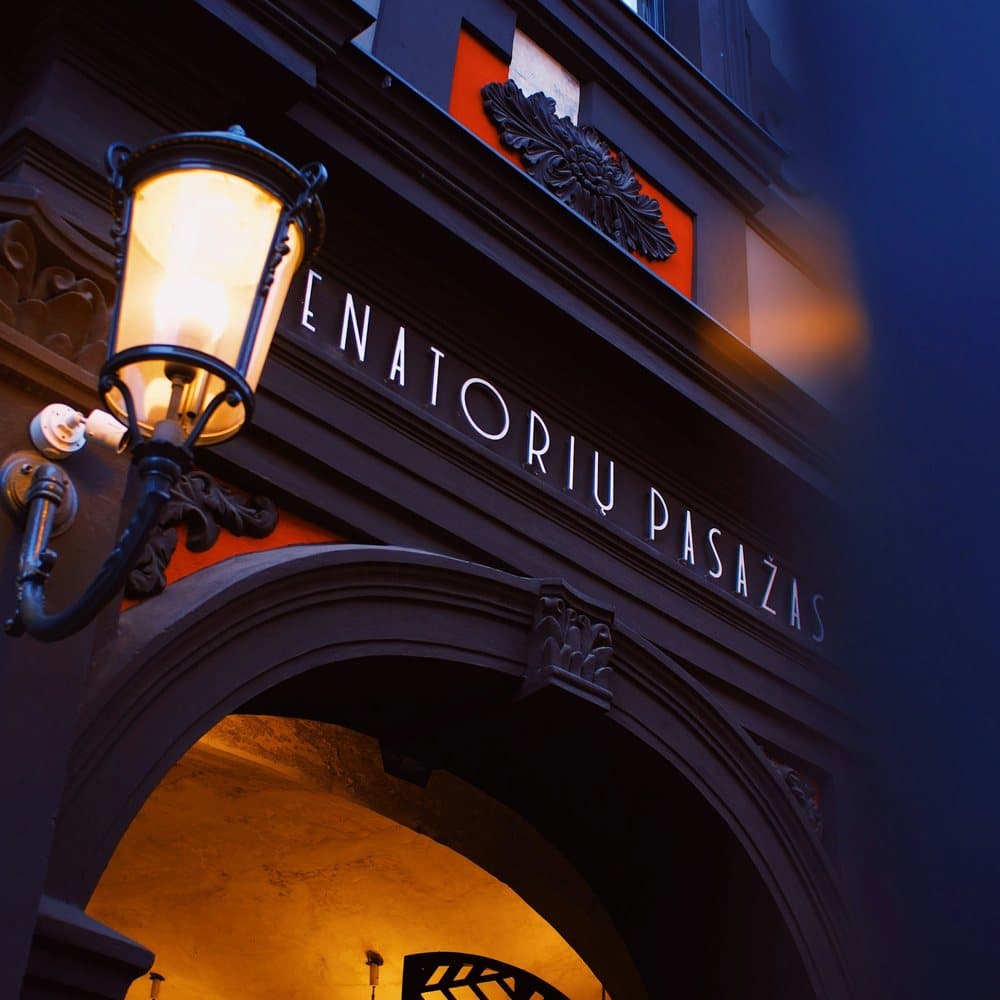 The entrance to a restaurant lit up at night